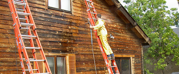 Preserving log homes - working on side of log home